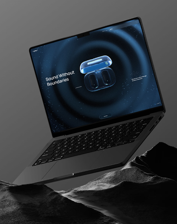 Laptop showcasing earbuds website on rocky terrain